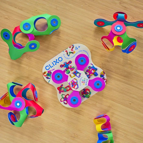 Colorful toy with 'Clixo' branding on a wooden surface