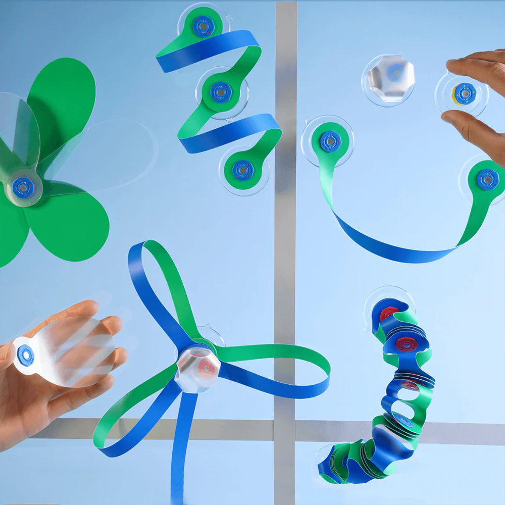 Colorful objects being manipulated against a light blue background