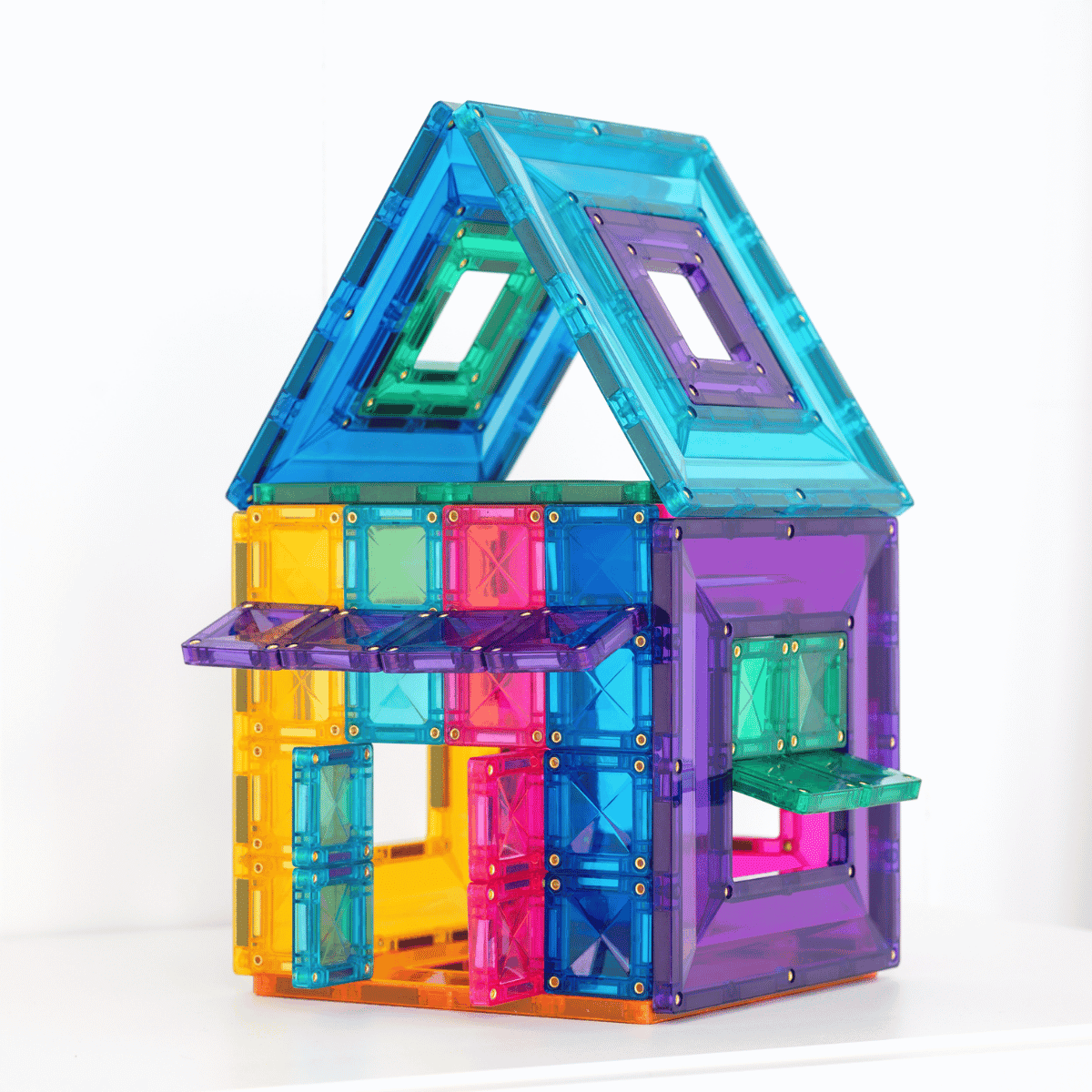 Colorful magnetic building block set shaped like a house on a white background
