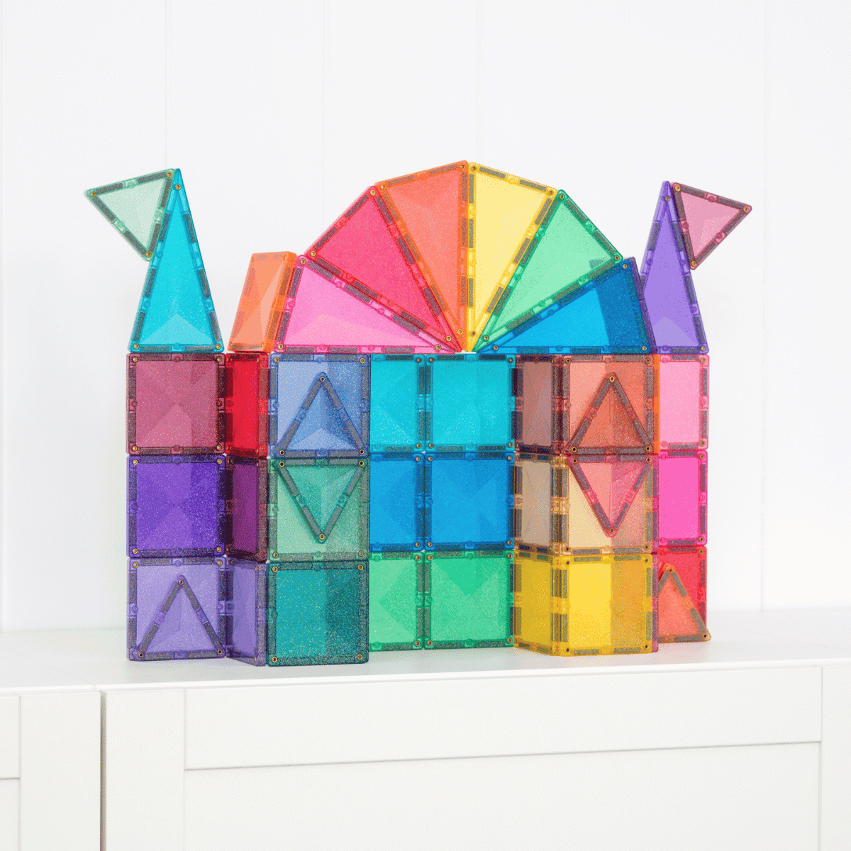 Colorful magnetic building block set on a white surface