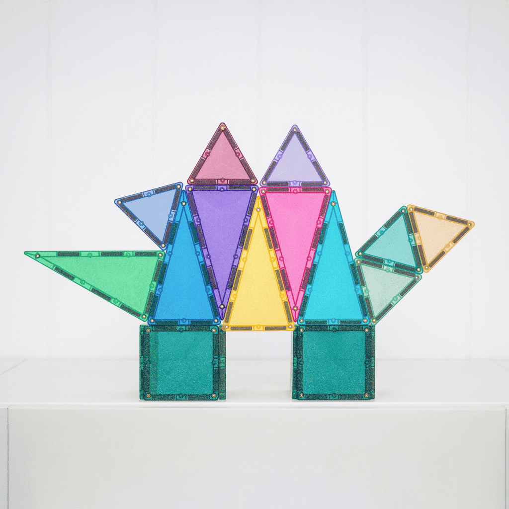 Colorful magnetic building blocks on a white background