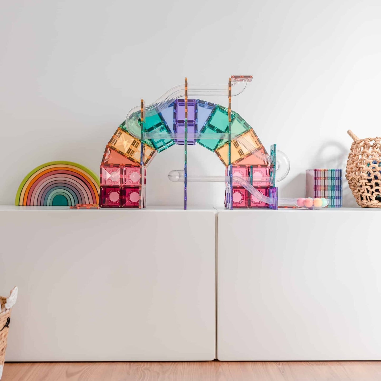 Colorful magnetic building toy set on a white surface with a neutral background