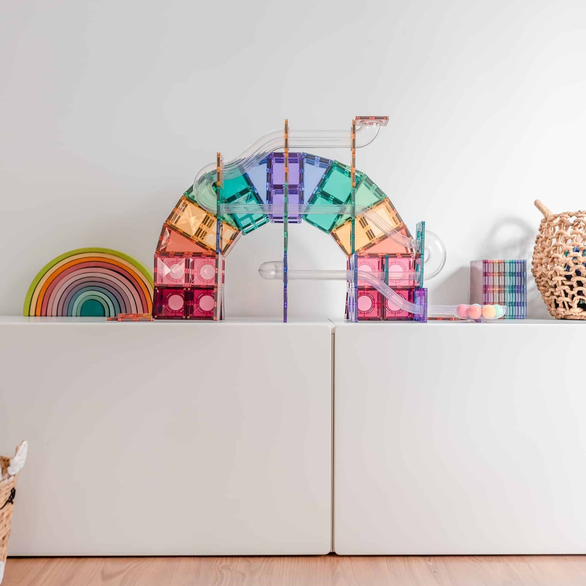 Colorful magnetic building toy set on a white surface with a neutral background