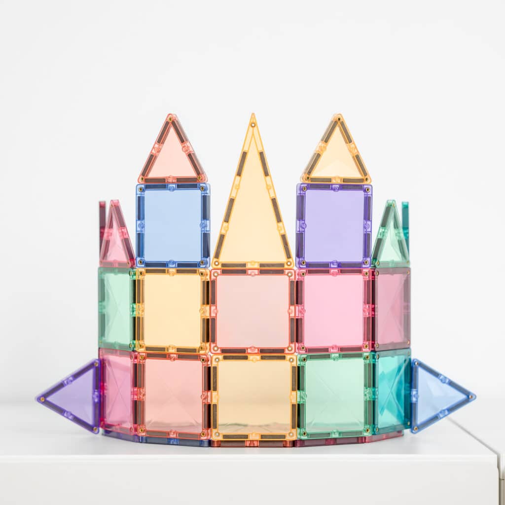 Colorful magnetic building block castle on a white background