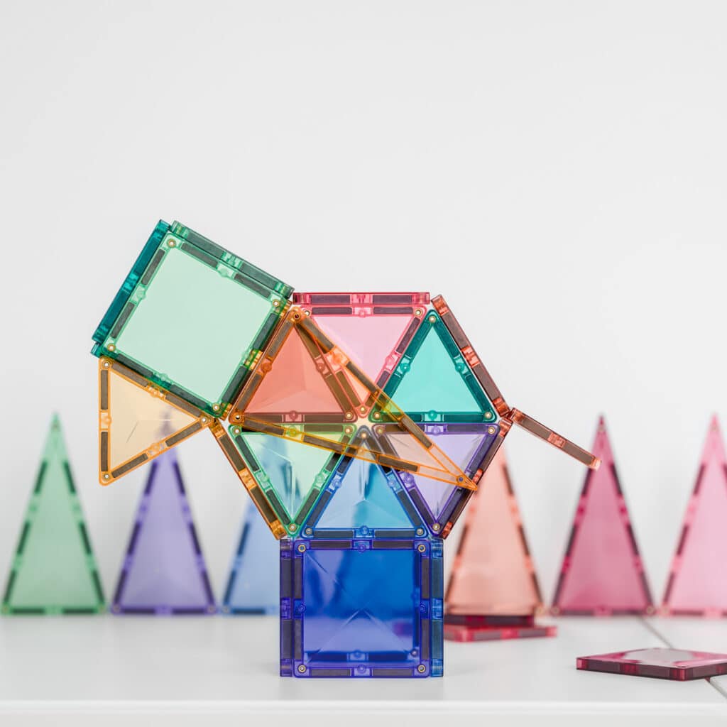 Colorful magnetic building blocks on a white background