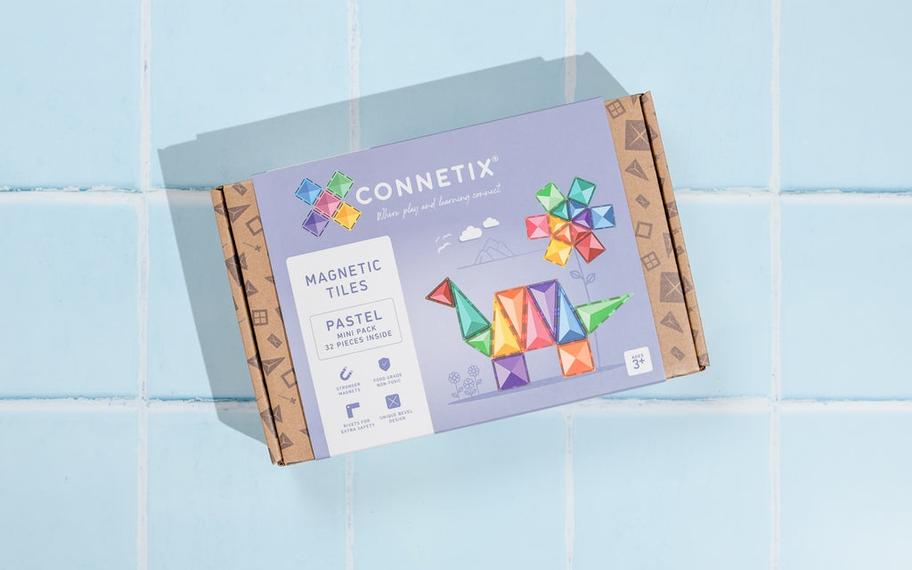 Connetix magnetic tiles packaging on a light blue tiled background