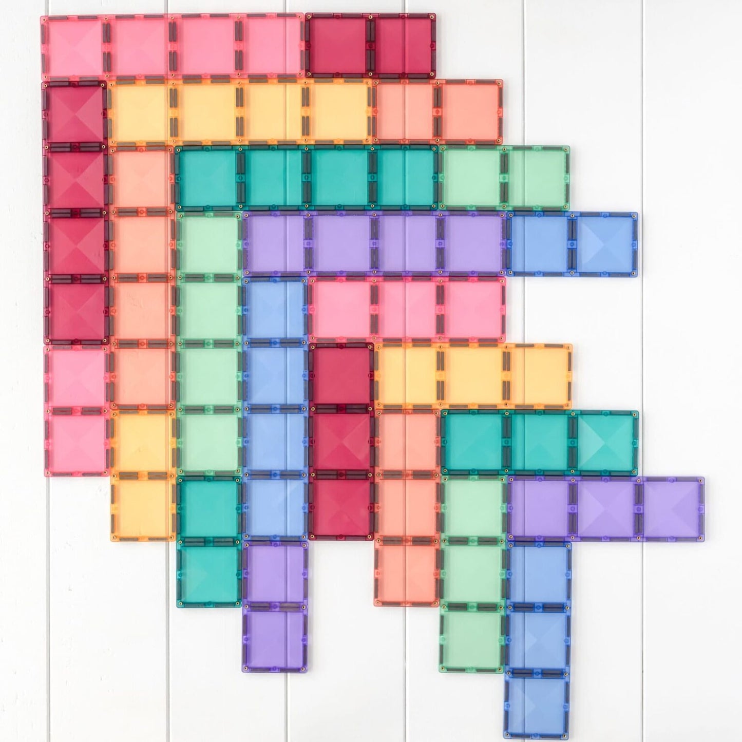 Colorful magnetic tile set on a white background
