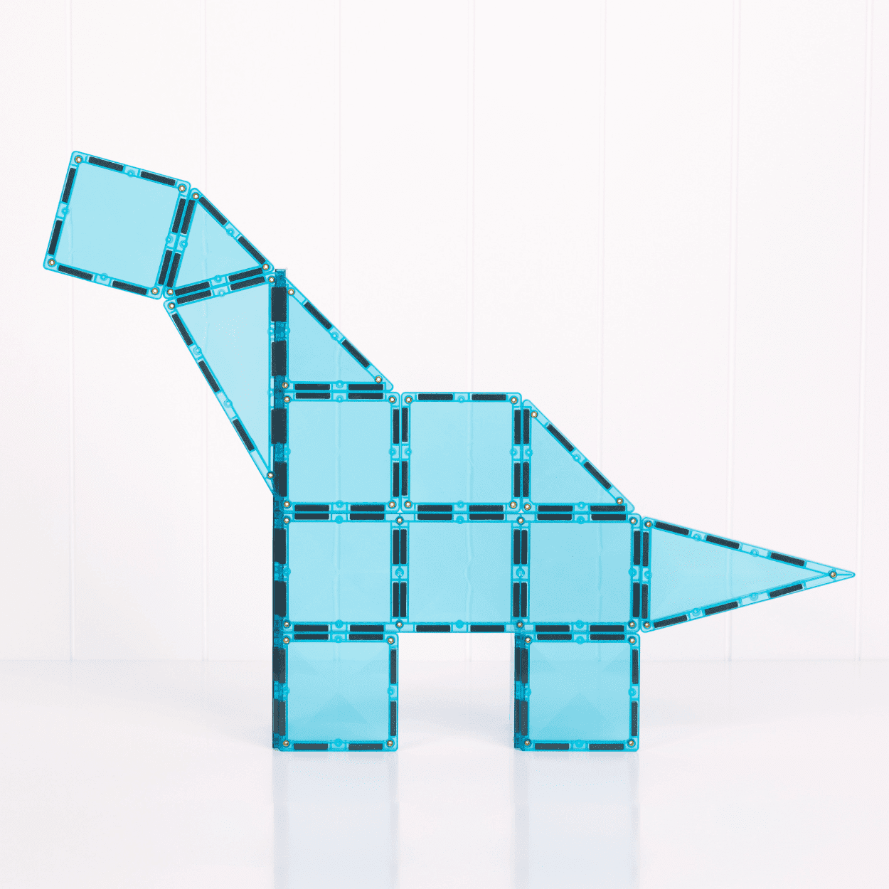 Blue dinosaur model made of interlocking tiles on a white background