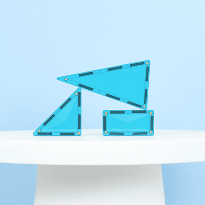 Three blue geometric shapes on a light blue background