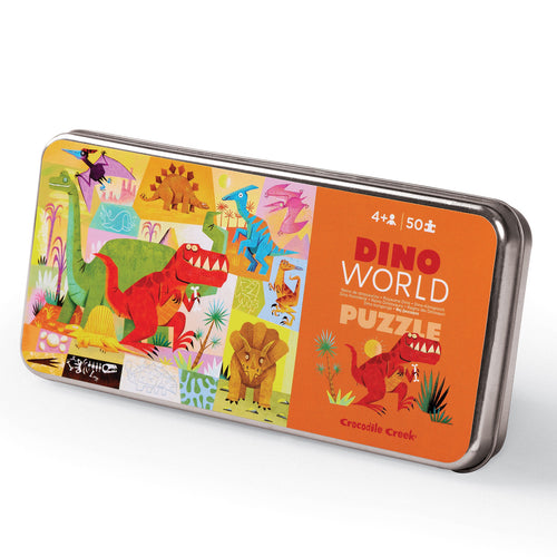 A 50-piece dinosaur-themed puzzle in a tin packaging, with illustrations of various dinosaurs and the text 'Dino World Puzzle 4+50 pieces' on the cover.