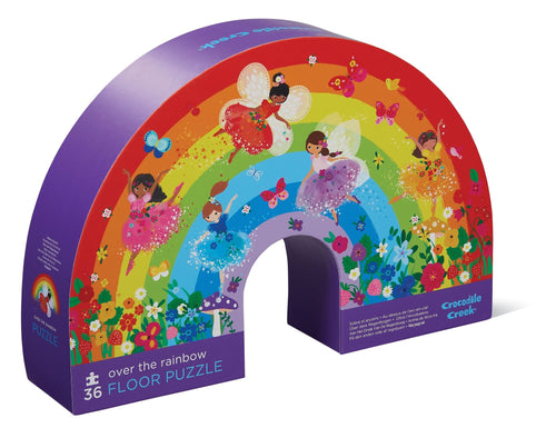 A colourful 36-piece floor puzzle in a rainbow shape with illustrations of fairies, packaged in a box with a matching design.