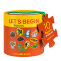 A set of children's puzzles with illustrations of Australian animals, packaged in a cylindrical box with a red ribbon.