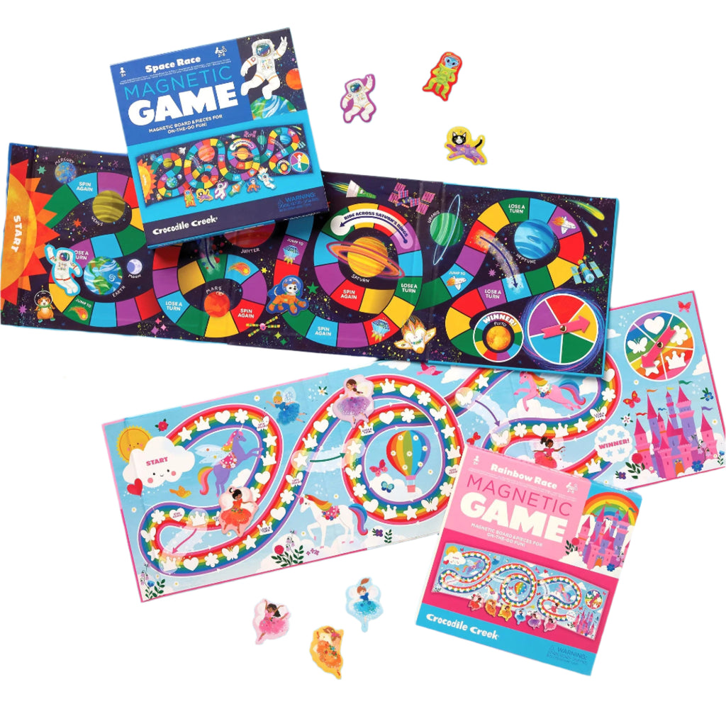 Assorted magnetic game pieces and boards laid out on a blue surface, with colorful game pieces and instructions visible.