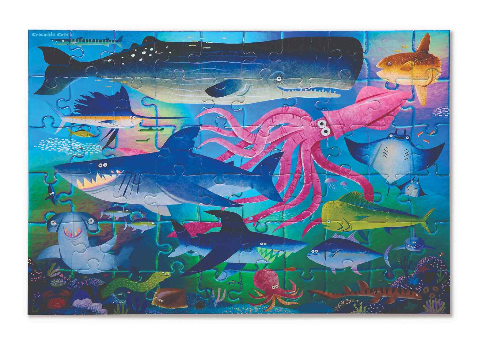 Children's puzzle with ocean-themed design featuring various sea creatures.
