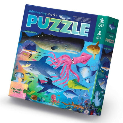 Shimmering sharks puzzle box with colorful illustrations of sharks and sea creatures on a white background