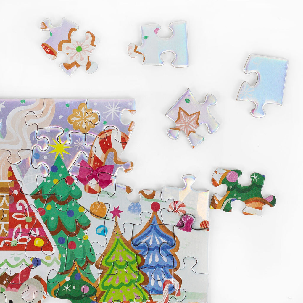 A colorful Christmas-themed jigsaw puzzle with several loose puzzle pieces scattered on a white background. The puzzle shows decorated Christmas trees, candy canes, ornaments, and festive holiday illustrations.
