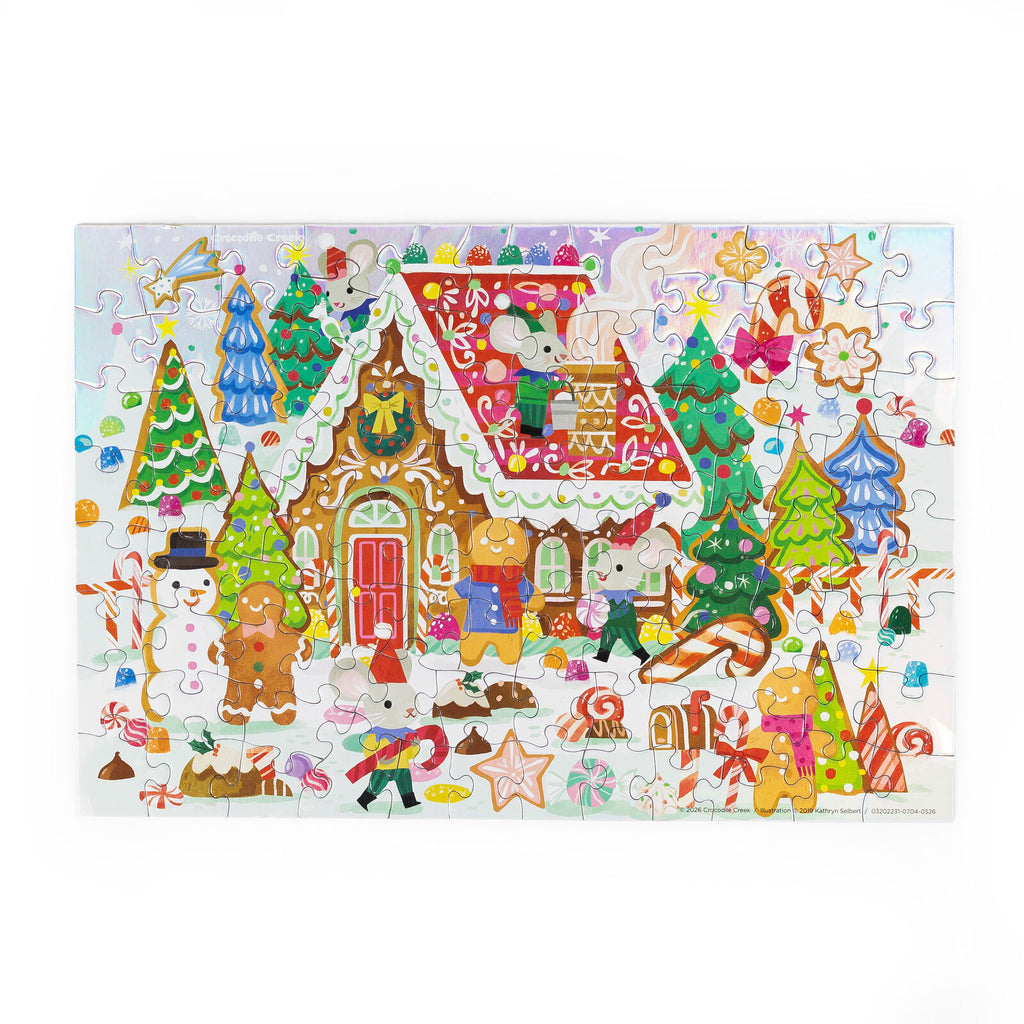 A completed multicolor Christmas gingerbread-themed jigsaw puzzle featuring cartoon animals, candy canes, snowman, trees, and houses on a white background.