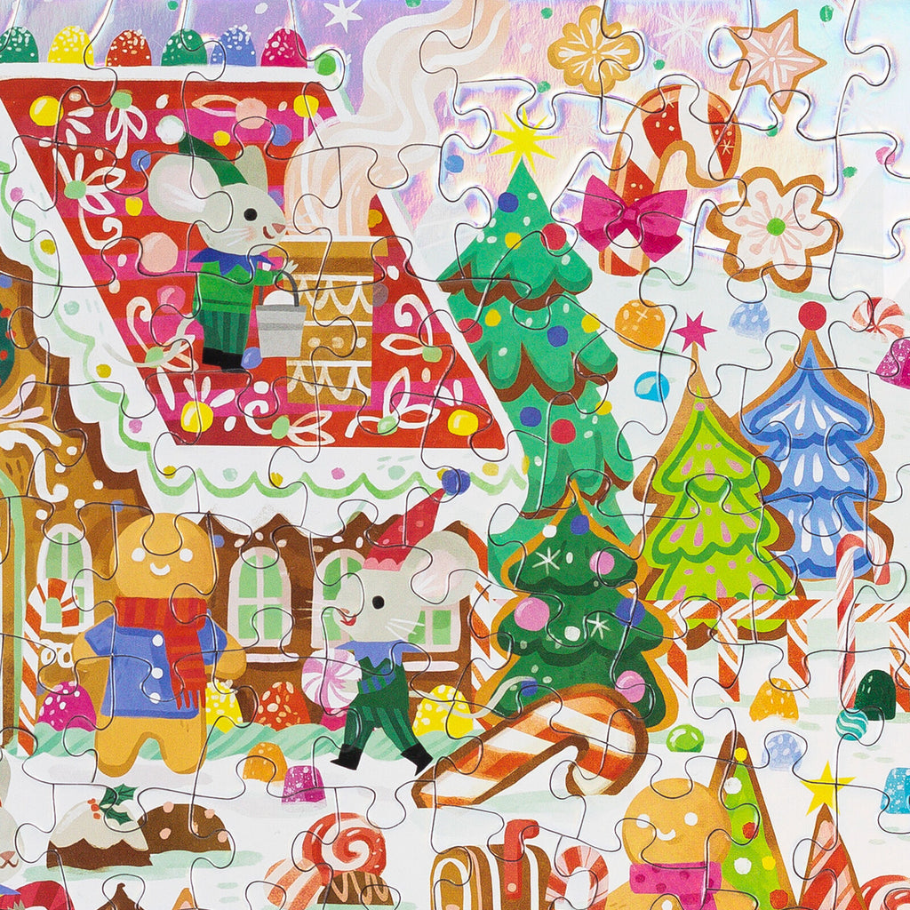 A colorful children's jigsaw puzzle featuring a whimsical holiday scene with mouse characters, decorated Christmas trees, candy canes, gingerbread houses, stars, and festive ornaments on a white background.