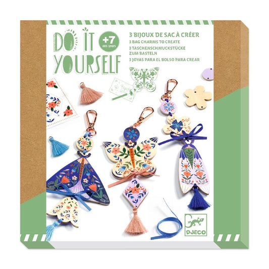 Packaging of a DIY jewelry kit with colorful charms and tassels on a white background.