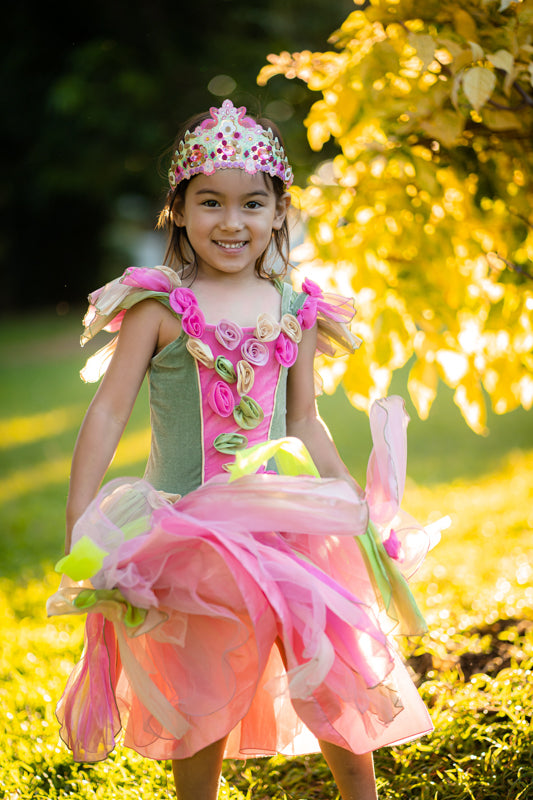 Child wearing tiara and princess dress.