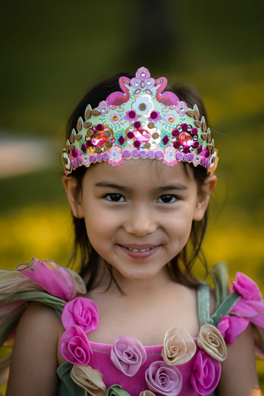 Child wearing mosaic tiara.