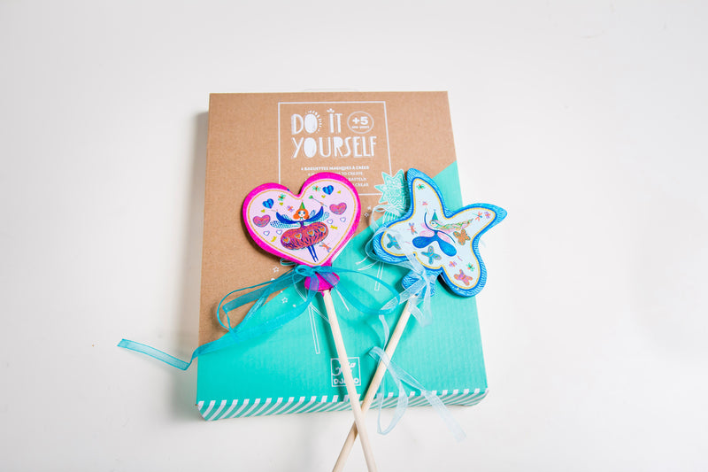 Packaging for 'Do It Yourself' magic wands kit and two wands on a white background.