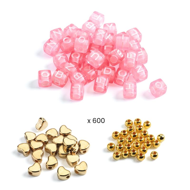 Pink letter beads and gold heart and round beads on a white background