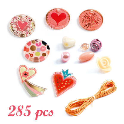 Assorted decorative items including heart-shaped and floral designs on a white background with '285 pcs' text.