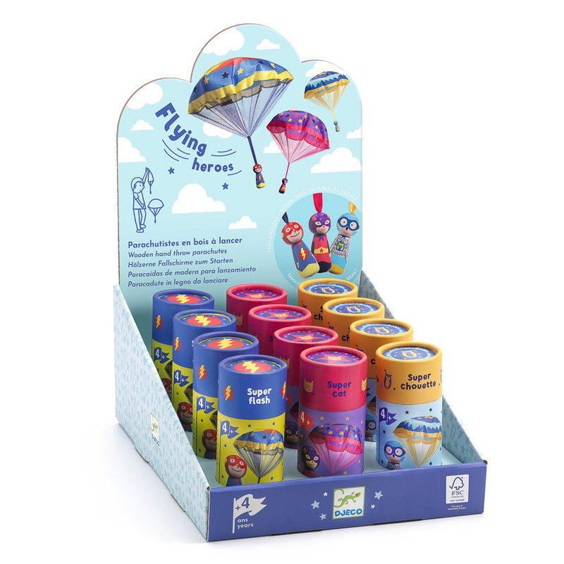 Display of colorful toy parachutes with packaging labeled 'Flying heroes' on a white background.