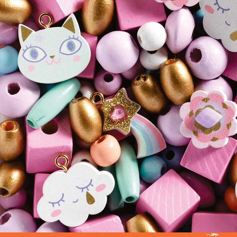 Assorted colorful beads and charms including a cat-shaped bead, star charm, and flower charm.