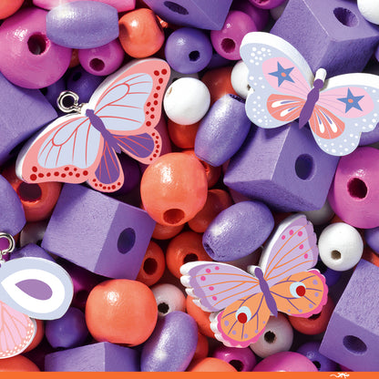 Colorful assortment of butterfly-shaped beads and blocks with a focus on purple and orange.