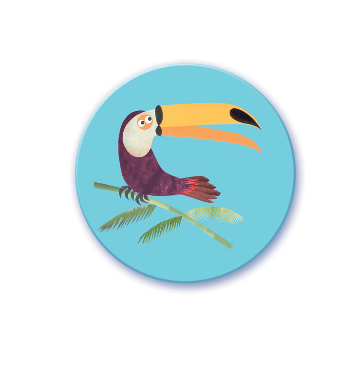 Round blue coaster with a colorful toucan design on a white background