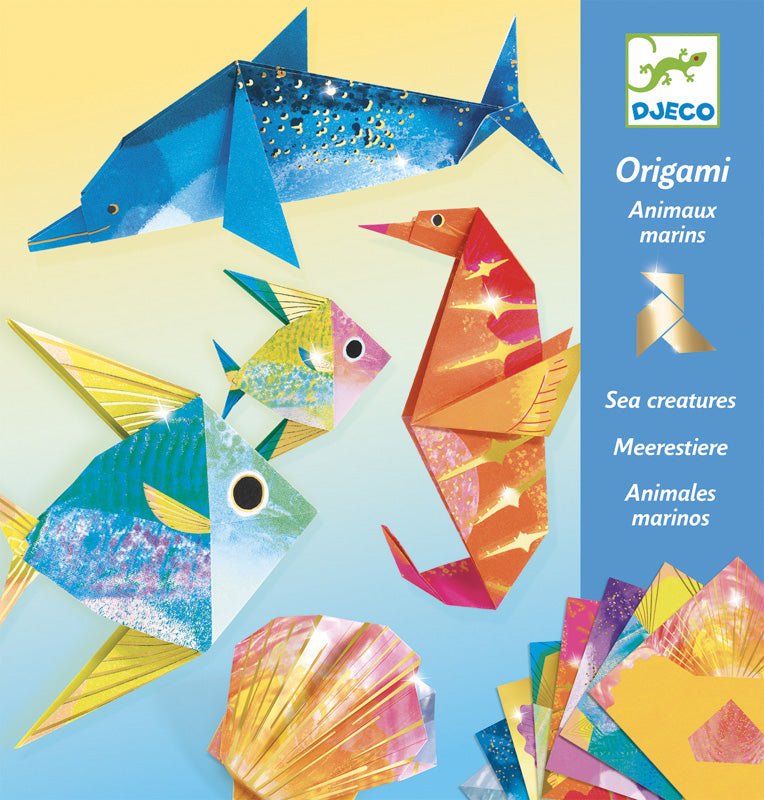 Origami sea creature set with colorful paper and packaging on a blue background