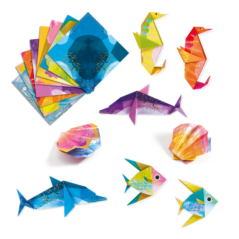 Colorful origami fish and seahorses on a white background