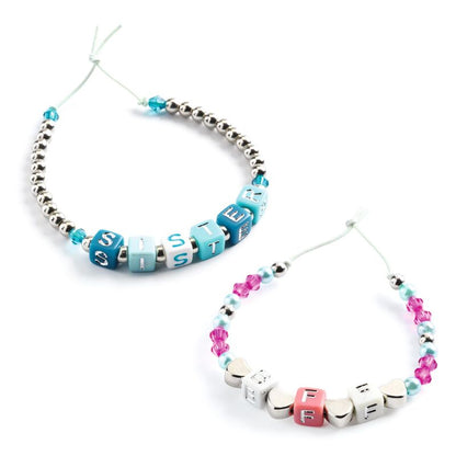 Two beaded necklaces with letter beads spelling out 'SISTERS' on a white background.