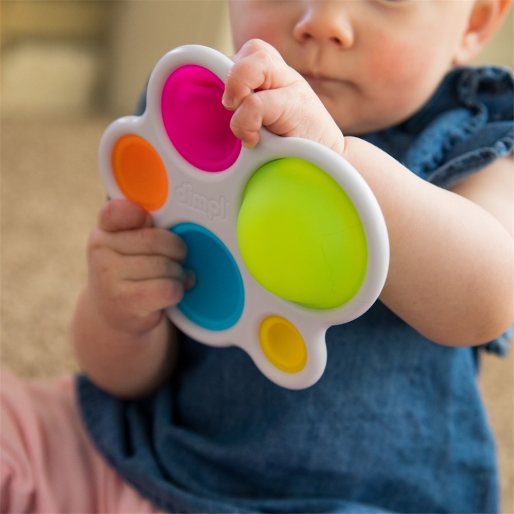 Baby playing with Fat Brain Toys - Dimpl 