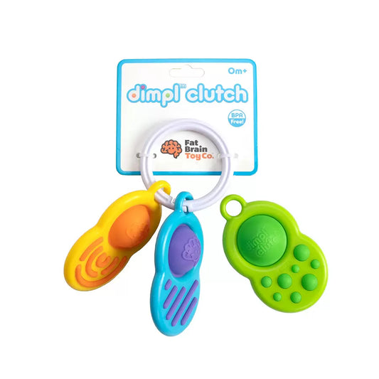 Colorful baby teething toy with 'dimplé Clutch' packaging on a white background