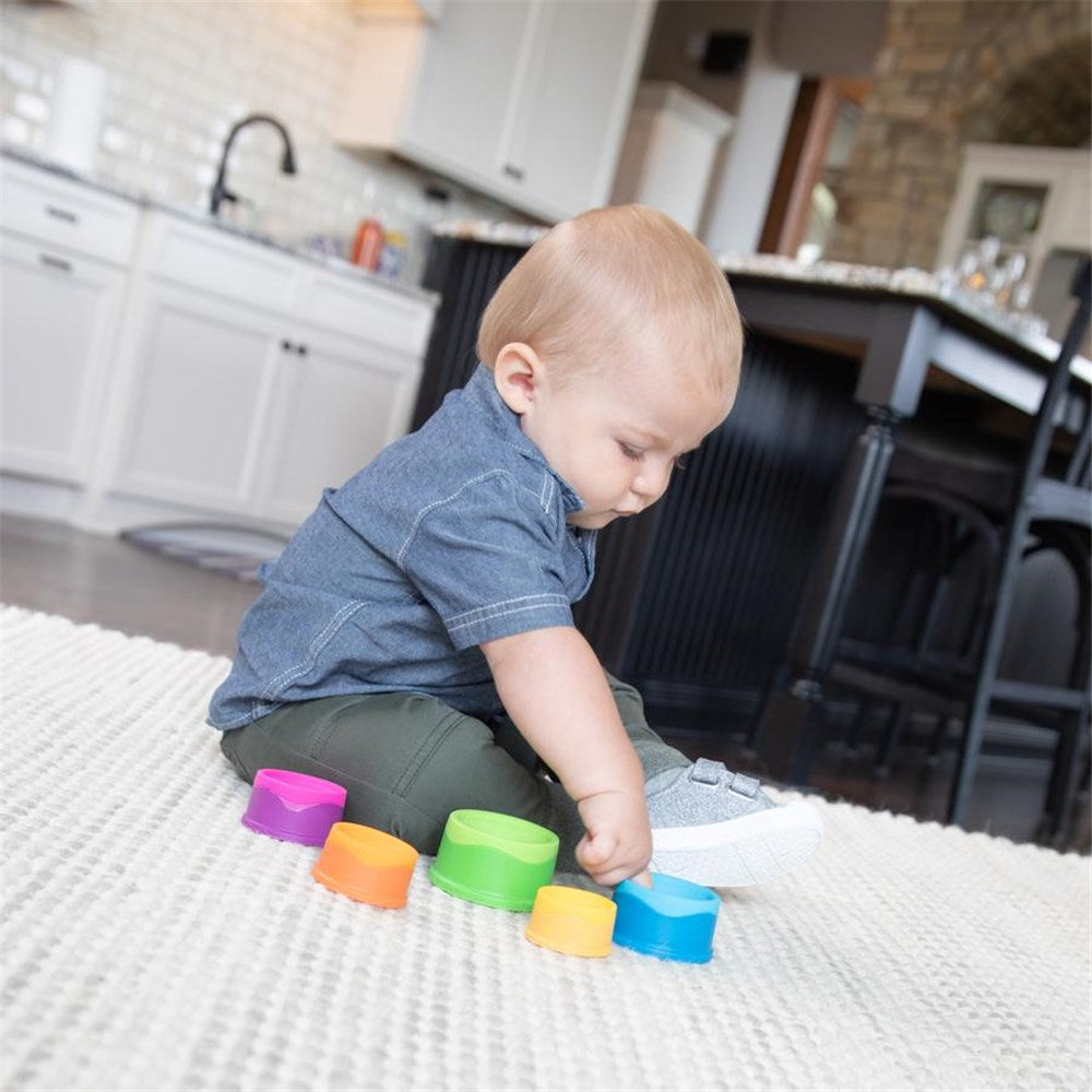 Baby playing with Fat Brain Toys - Dimpl Stack