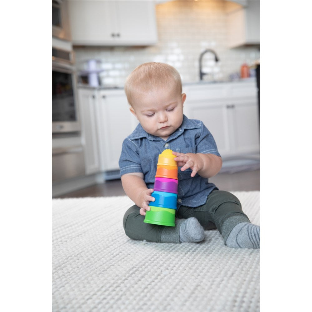 Baby playing with Fat Brain Toys - Dimpl Stack