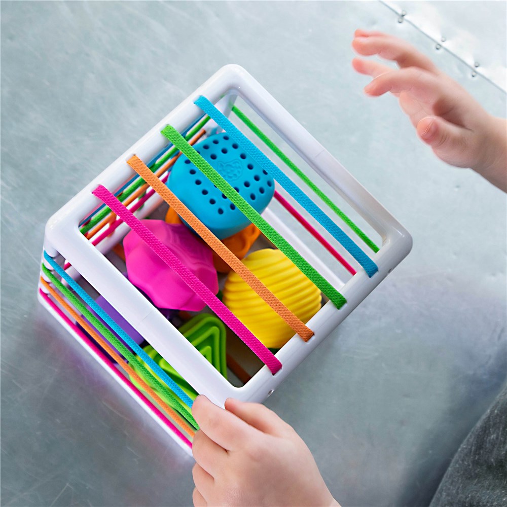 Child playing with Fat Brain Toys - InnyBin