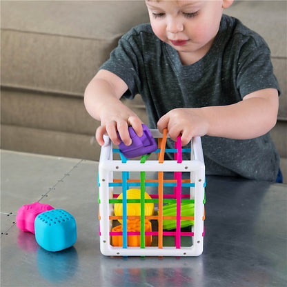 Child playing with Fat Brain Toys - InnyBin