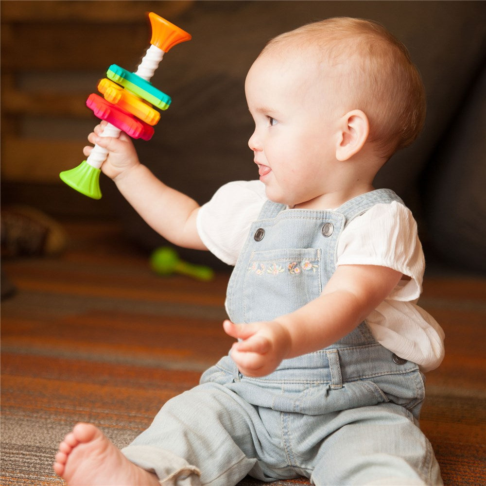 Baby playing with Fat Brain Toys - MiniSpinny