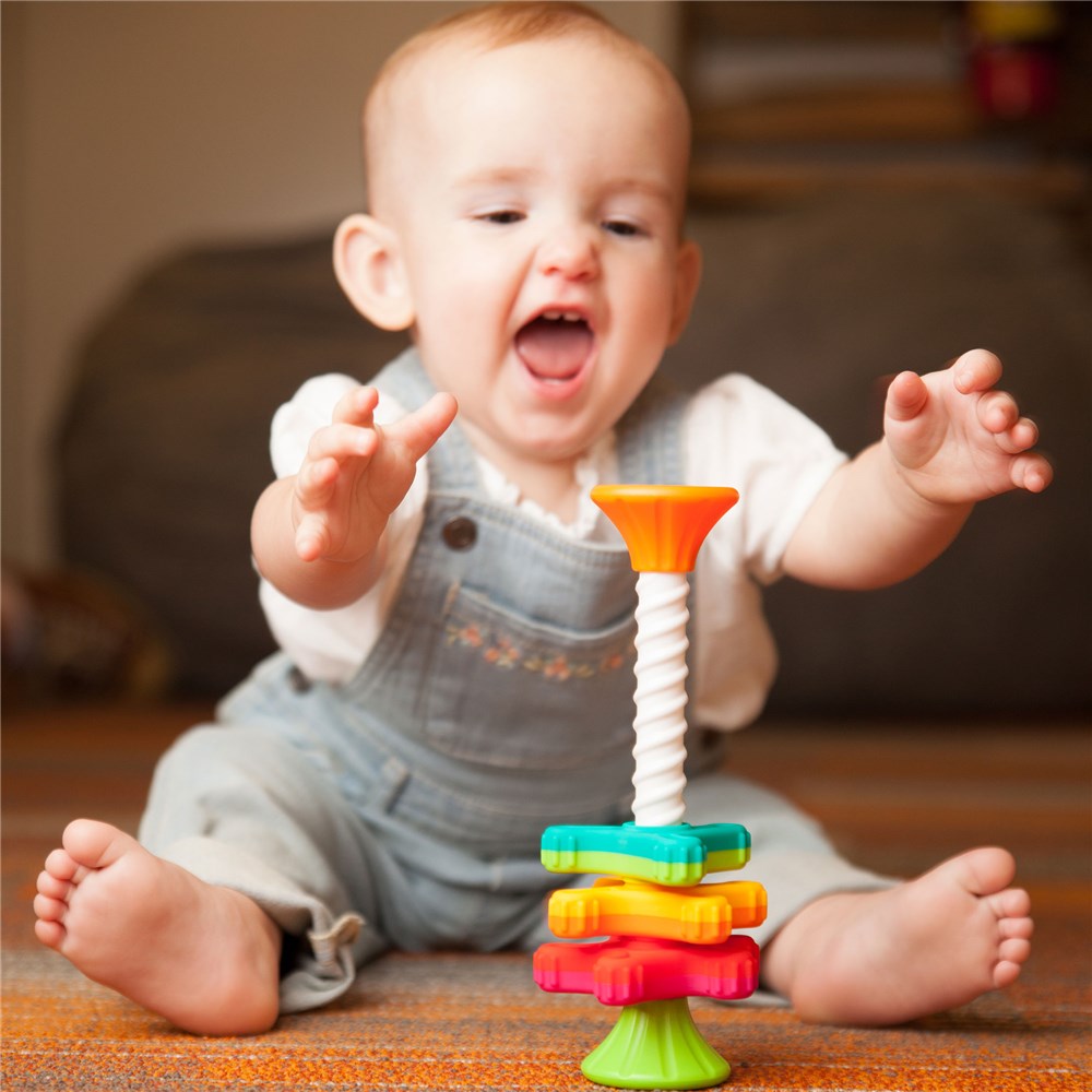 Baby playing with Fat Brain Toys - MiniSpinny