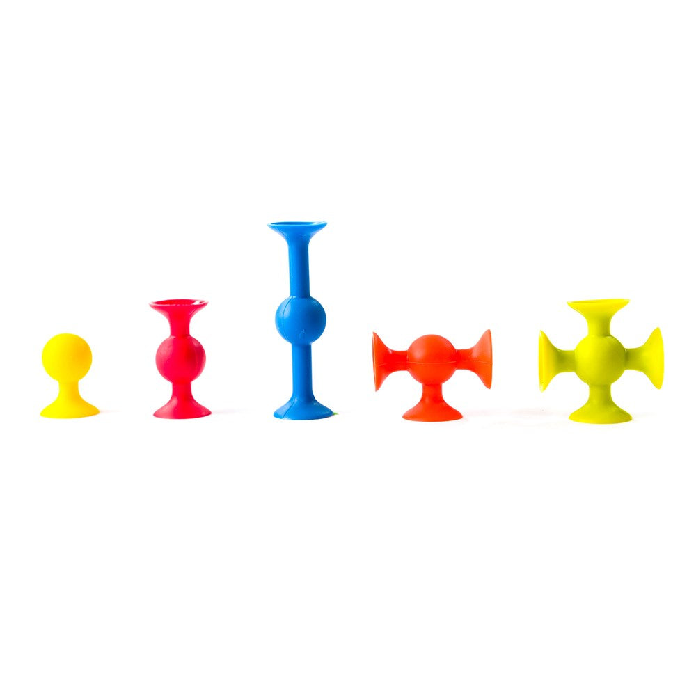 Set of colorful squigz pieces on a white background