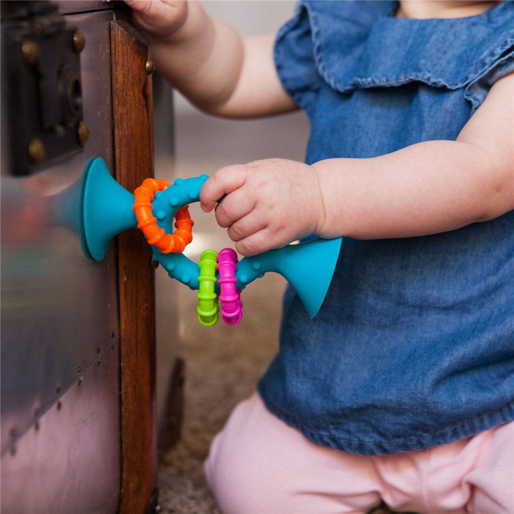 Child playing with Fat Brain Toys - PipSquigz Loops