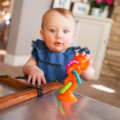 Baby playing with Fat Brain Toys - PipSquigz Loops