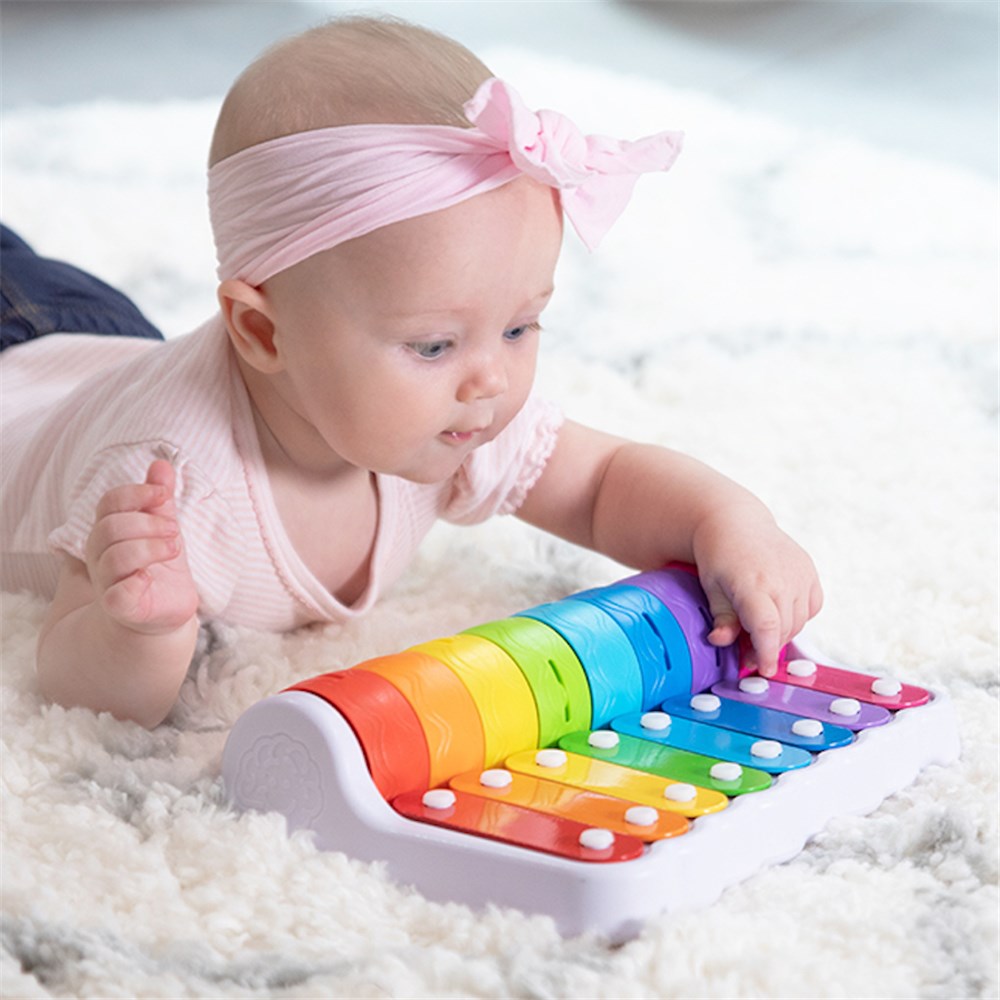Baby playing with Fat Brain Toys - Rock 'n Roller Piano