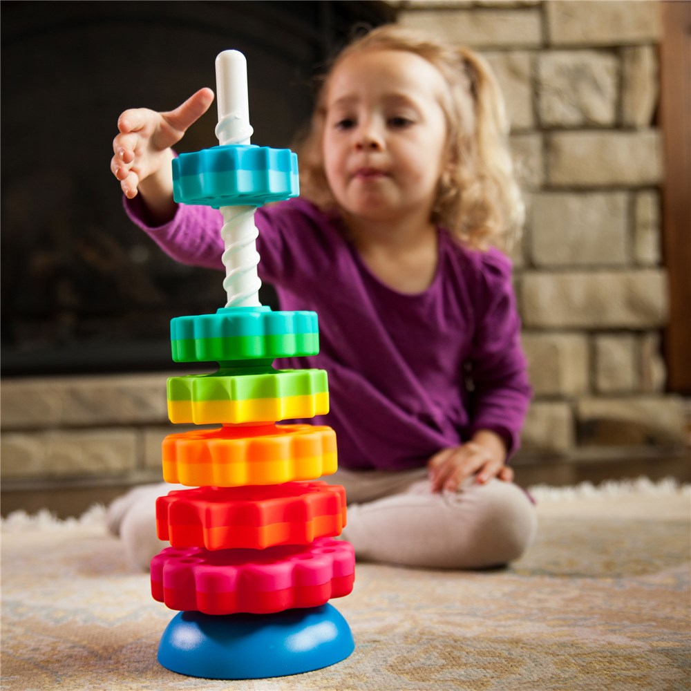 Child playing with Fat Brain Toys - SpinAgain