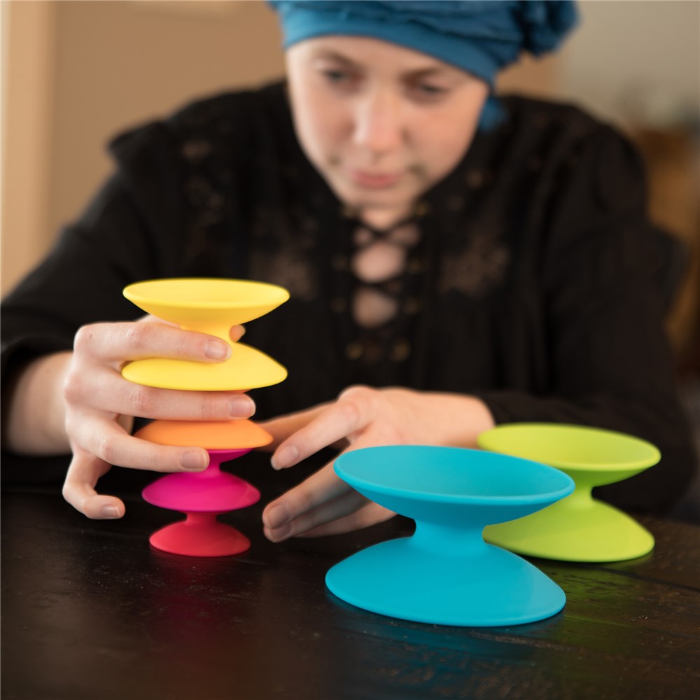 Adult playing with Fat Brain Toys - Spoolz