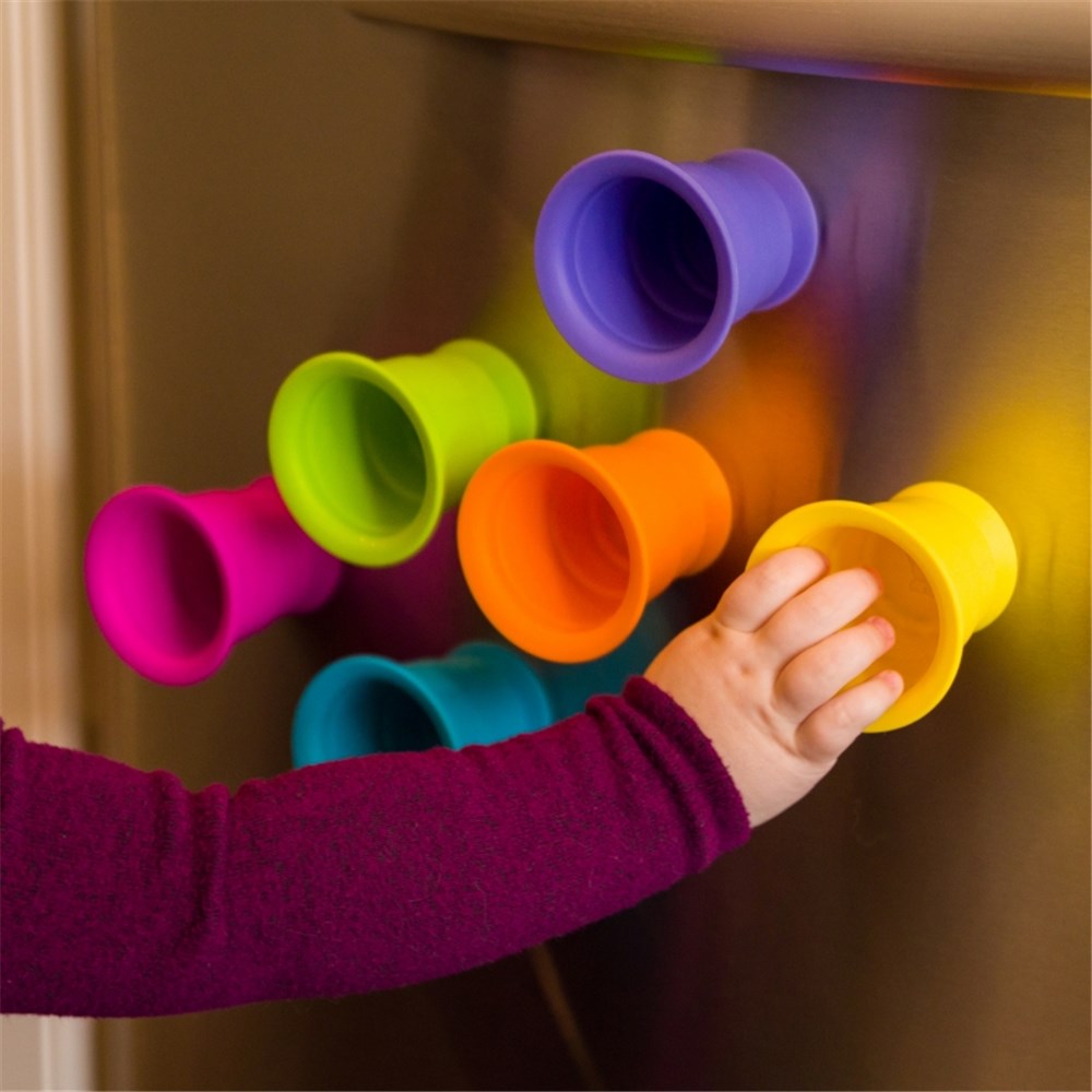 Baby playing with Fat Brain Toys - Suction Kupz